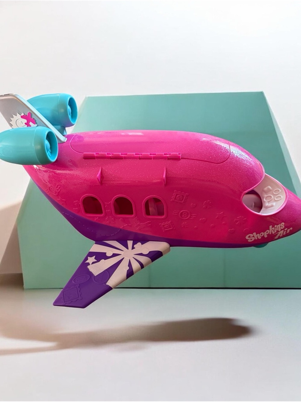 Shopkins Bright Pink Toy Airplane with Purple Wing and Teal Engines
